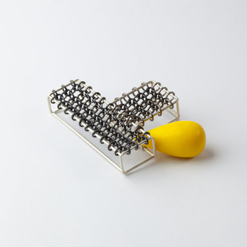 Brooch with yellow bead